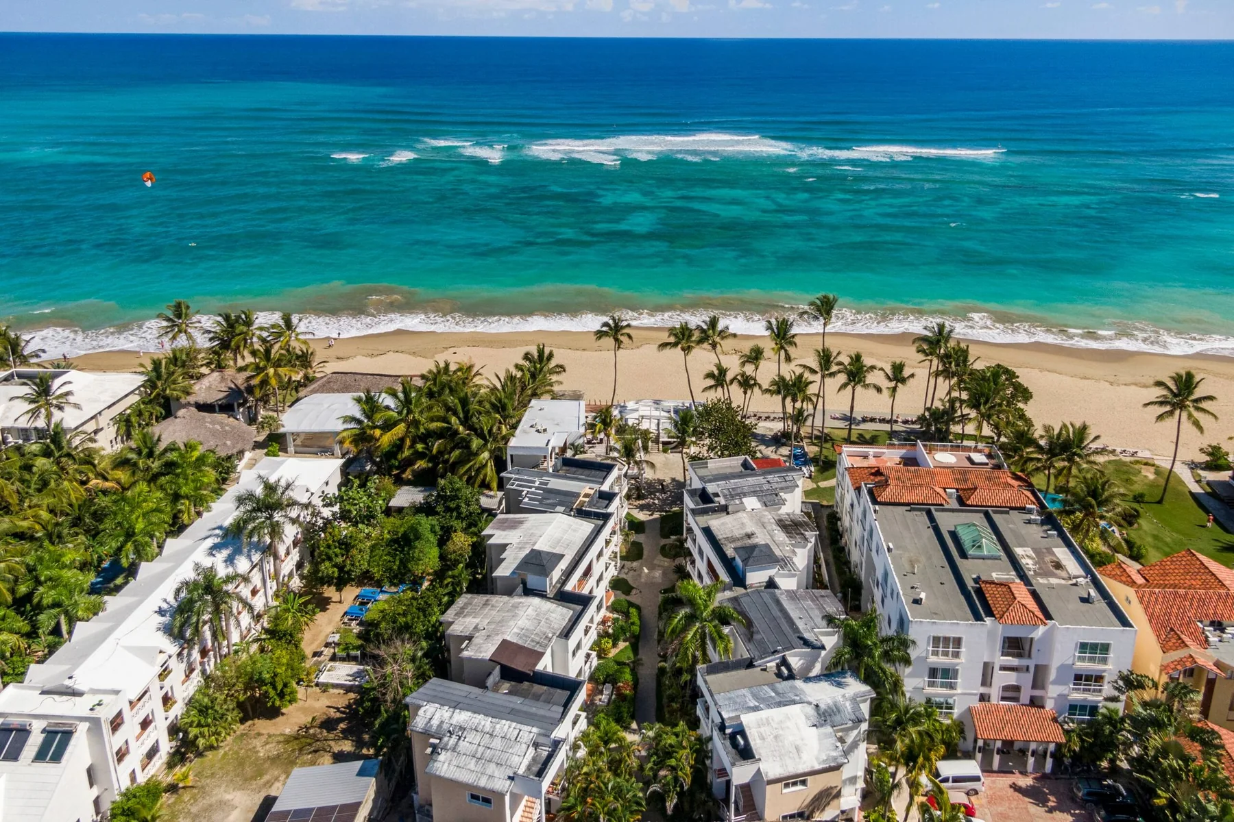 Aerial view of the complex showing the condo's position steps from Kite Beach