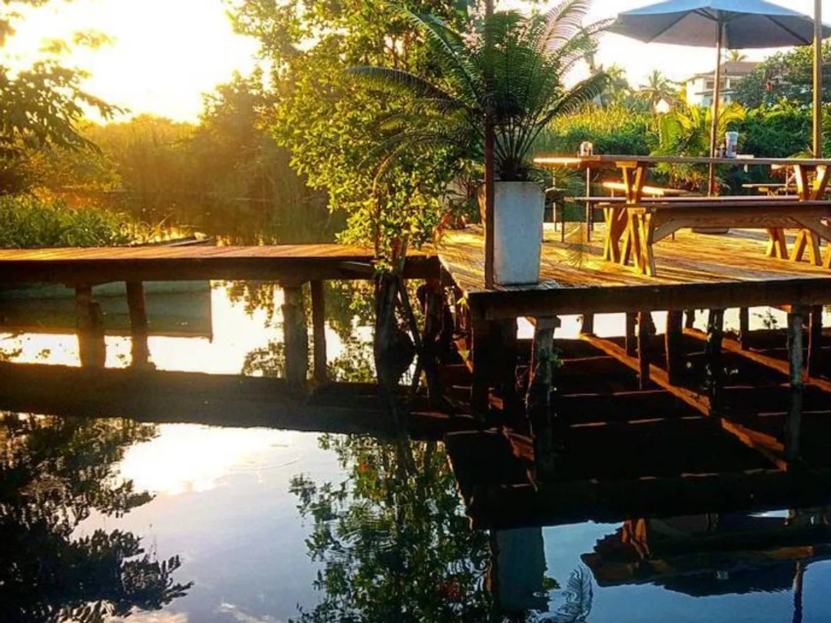 Lagoon-side dining area at Ali's Surf Camp restaurant in Cabarete