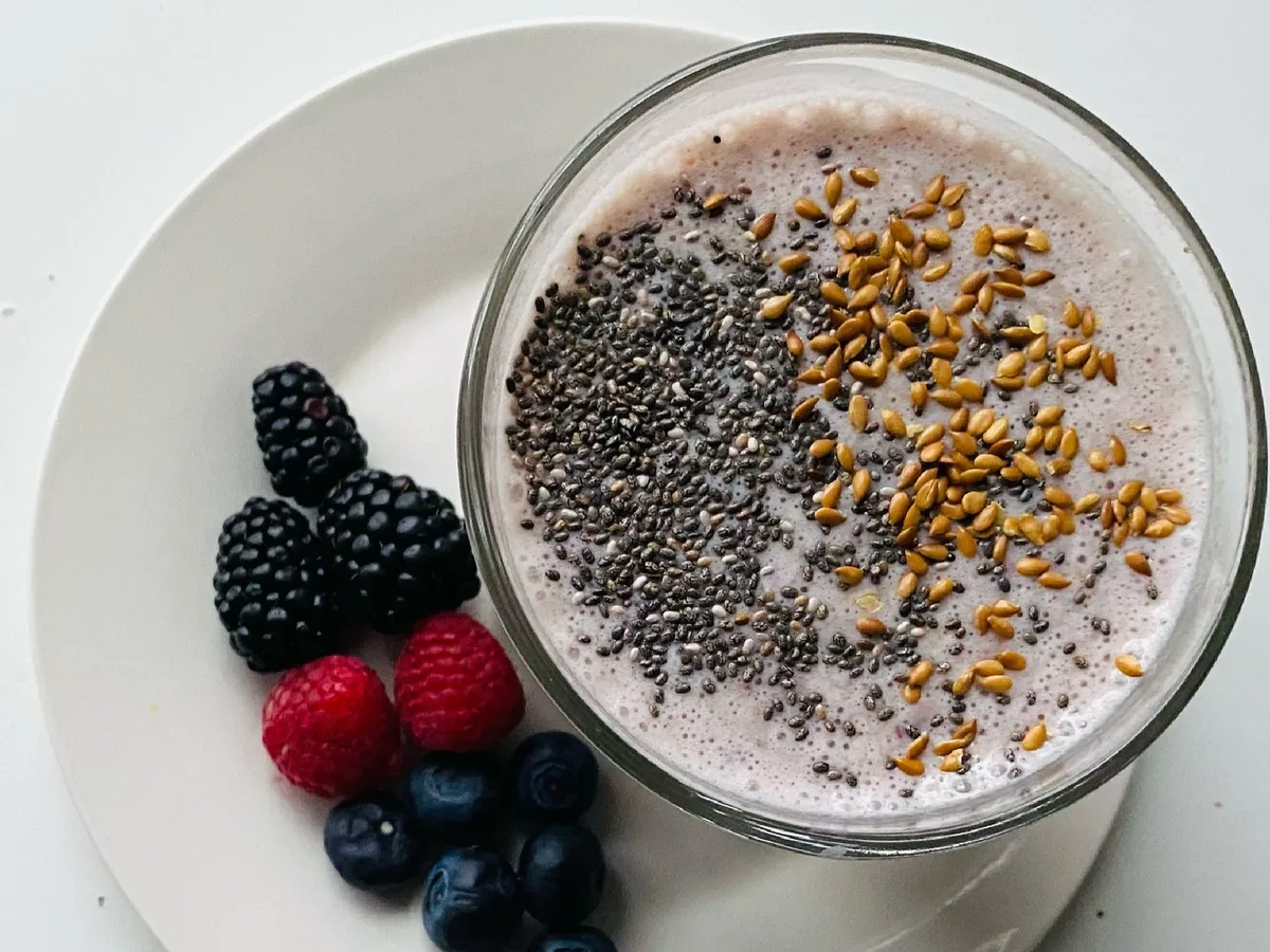 Fresh berry smoothie bowl topped with chia and flax seeds, a generic healthy breakfast photo