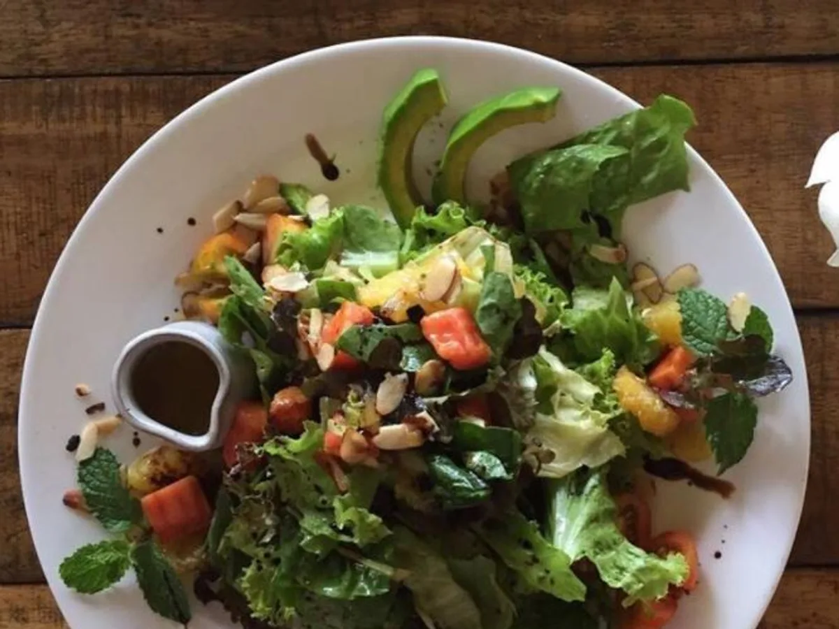 Fresh salad with avocado and balsamic dressing served at Natura Cabana near Cabarete