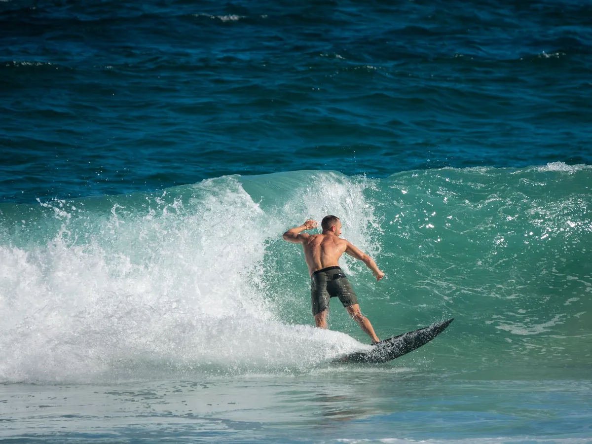 Surfer riding a breaking wave, a generic surfing photo representing Playa Encuentro